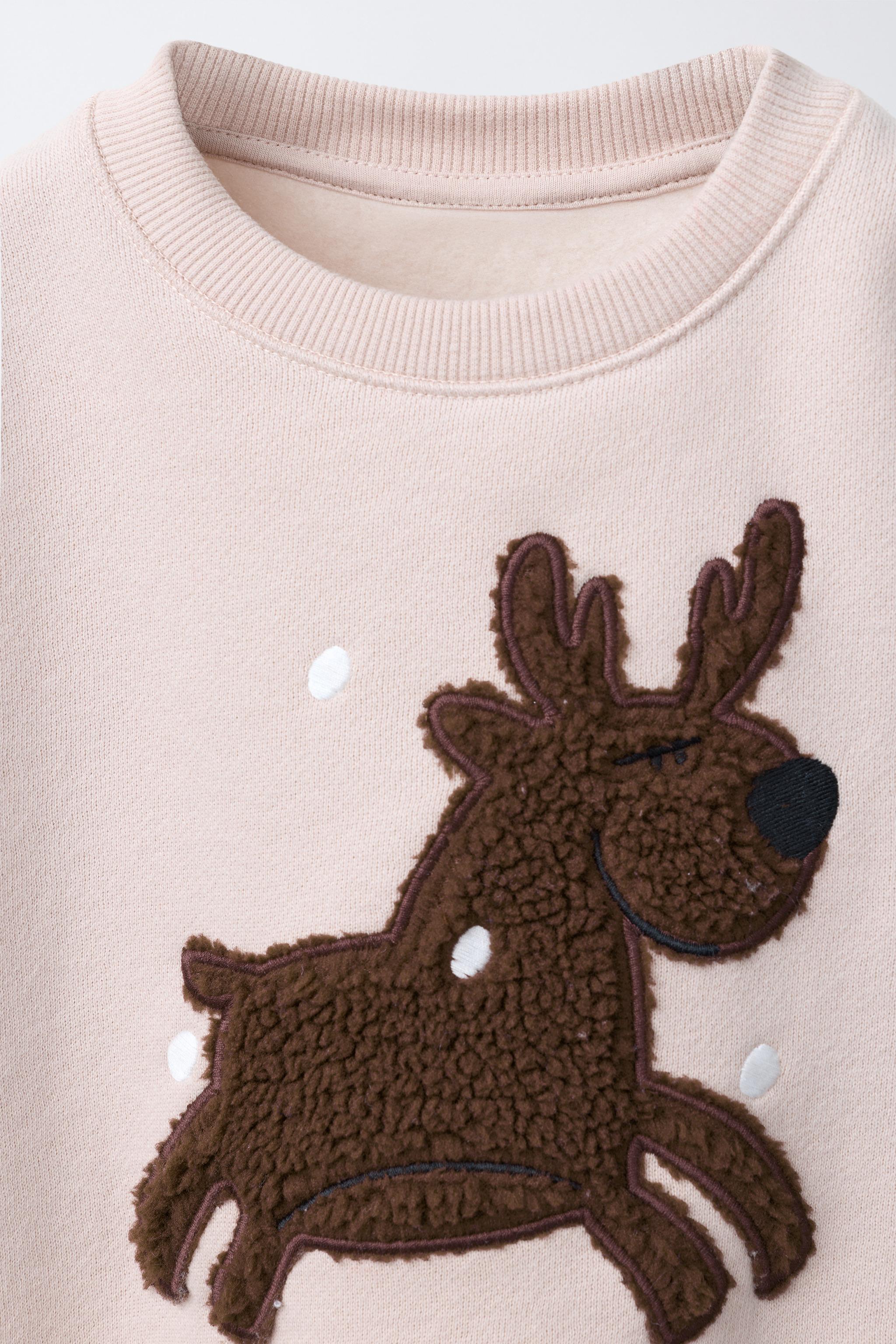 REINDEER FAUX SHEARLING PATCH SWEATSHIRT